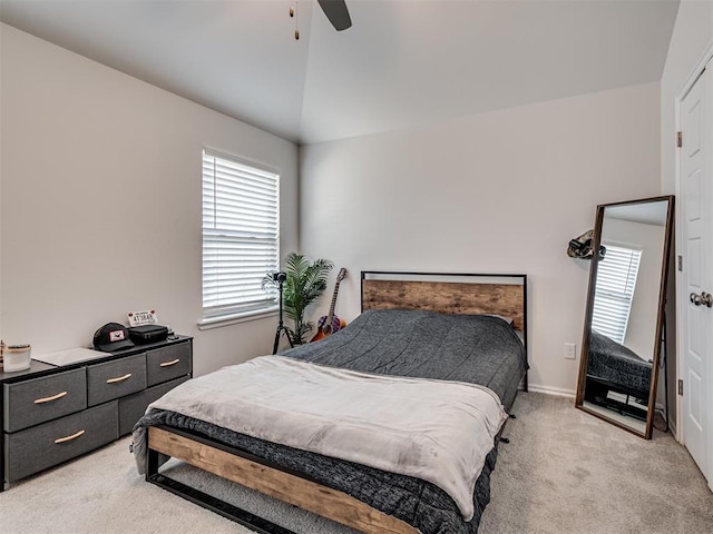 bedroom with ceiling fan, light carpet, and lofted ceiling