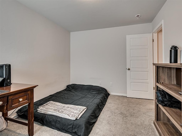 bedroom with light colored carpet