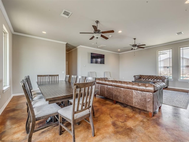 dining room with ornamental molding and ceiling fan