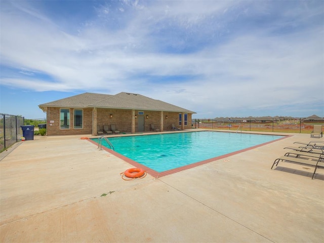 view of swimming pool featuring a patio