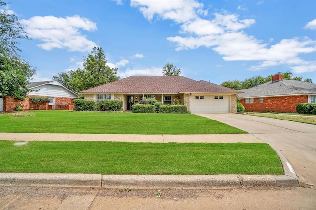 single story home featuring a garage and a front yard