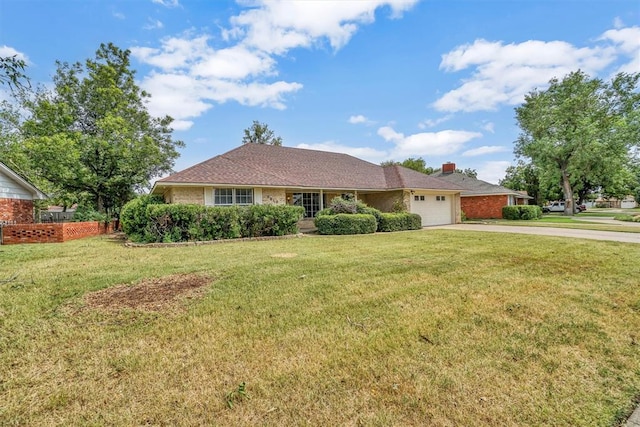 ranch-style house featuring a garage and a front lawn