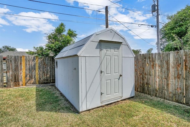 view of outbuilding featuring a yard