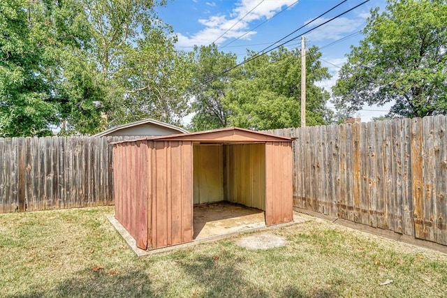 view of outbuilding featuring a lawn