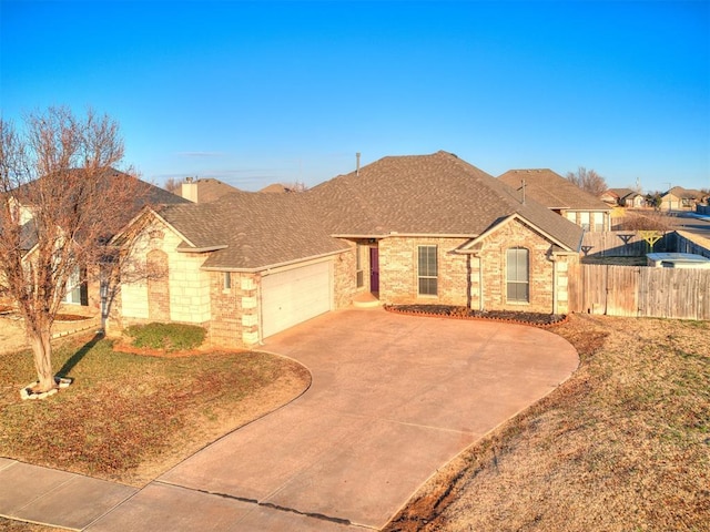 ranch-style home featuring a garage