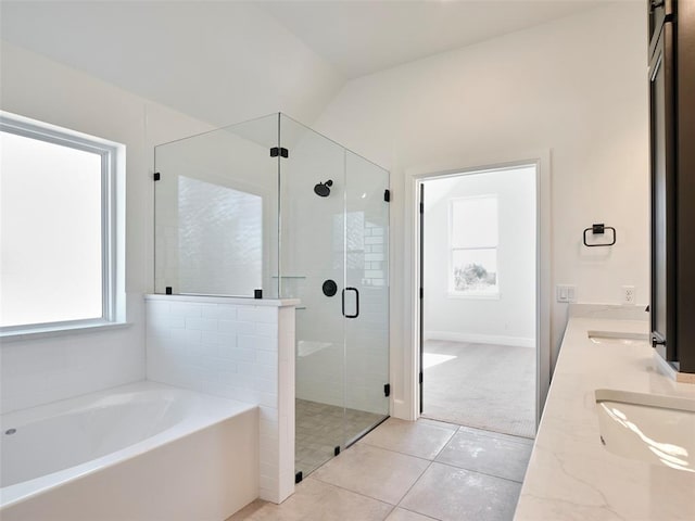 bathroom with lofted ceiling, tile patterned flooring, plus walk in shower, and vanity