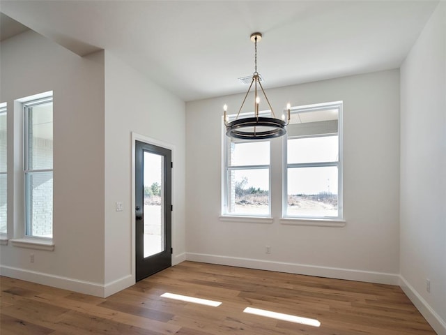 9116 SW 92nd St, Mustang, OK 73064 - foyer entrance with a chandelier, light wood-style floors, and baseboards