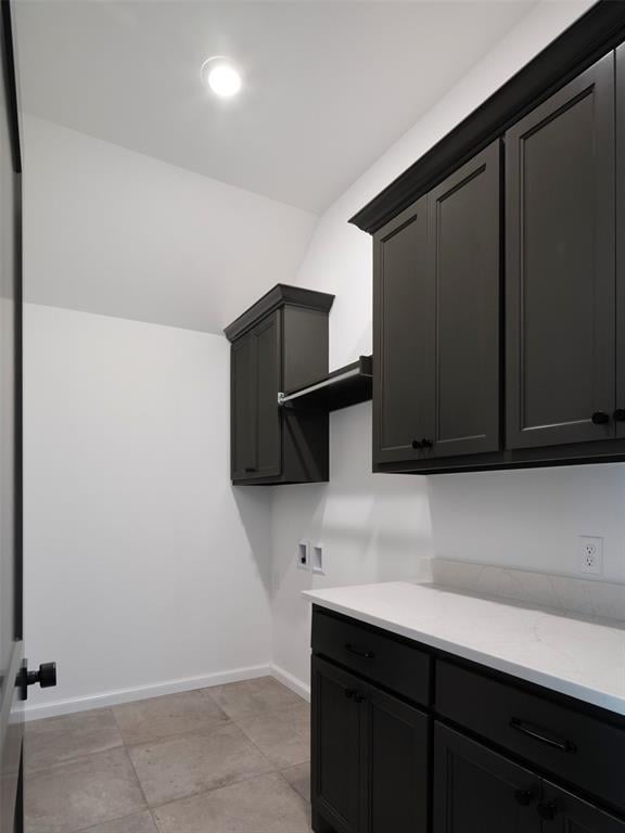 9116 SW 92nd St, Mustang, OK 73064 - laundry room with cabinet space, baseboards, and washer hookup