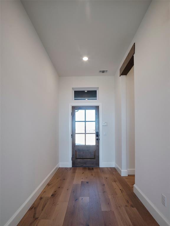 9116 SW 92nd St, Mustang, OK 73064 - doorway to outside featuring wood finished floors, baseboards, and recessed lighting