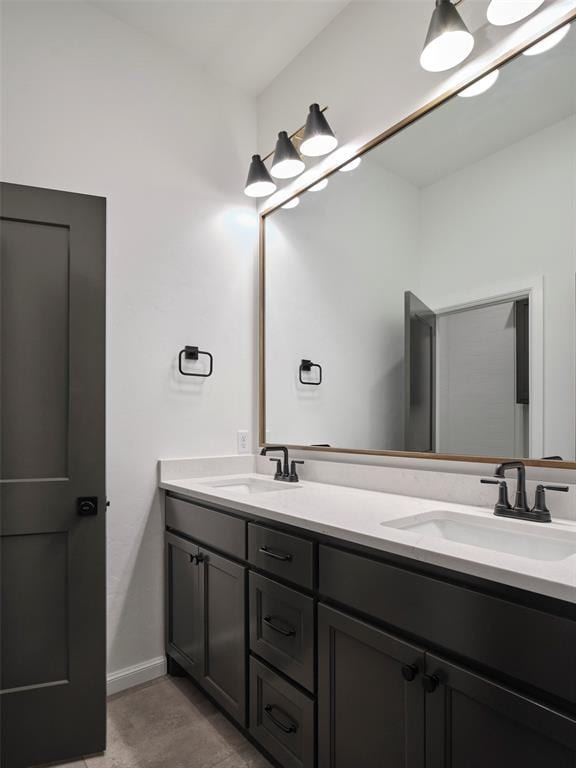 9116 SW 92nd St, Mustang, OK 73064 - bathroom featuring double vanity and baseboards