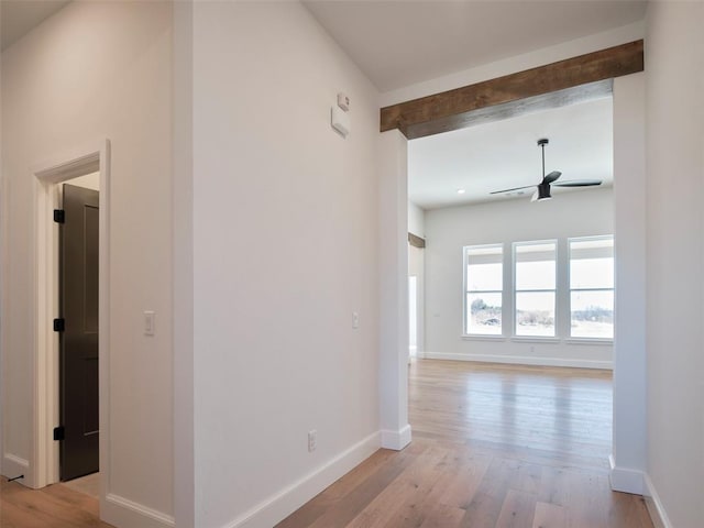 9116 SW 92nd St, Mustang, OK 73064 - hallway featuring beamed ceiling, light wood-style floors, and baseboards