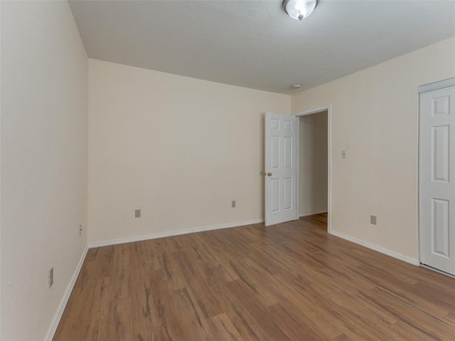 spare room featuring hardwood / wood-style flooring