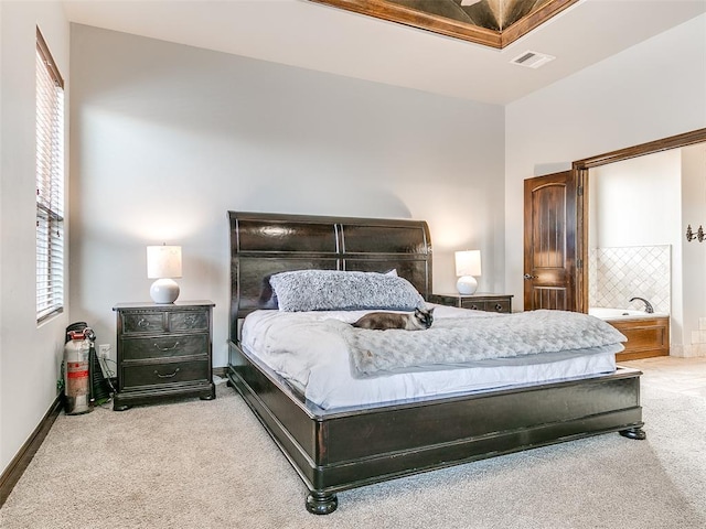 carpeted bedroom featuring multiple windows