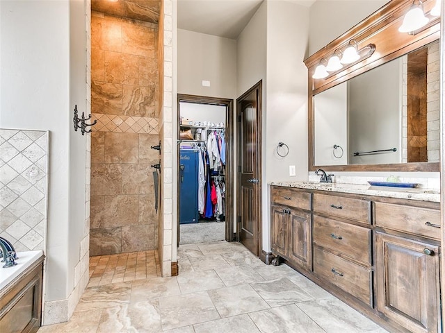 bathroom with independent shower and bath and vanity