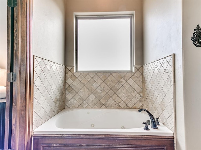 bathroom with a tub to relax in