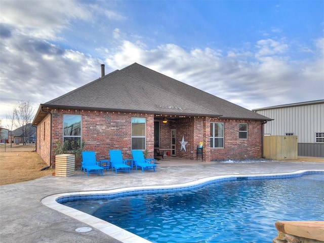 view of swimming pool featuring a patio area