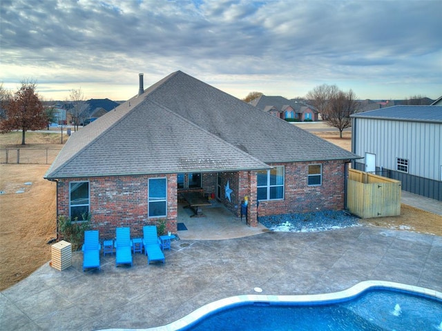 back of property with a patio area