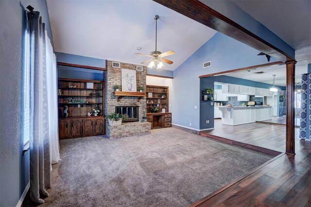 unfurnished living room with baseboards, ceiling fan, wood finished floors, and visible vents