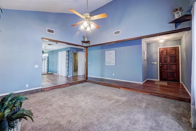 interior space with visible vents, a ceiling fan, and high vaulted ceiling