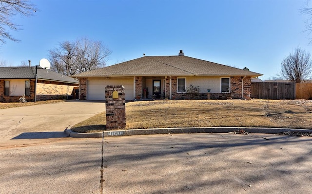 single story home featuring a garage