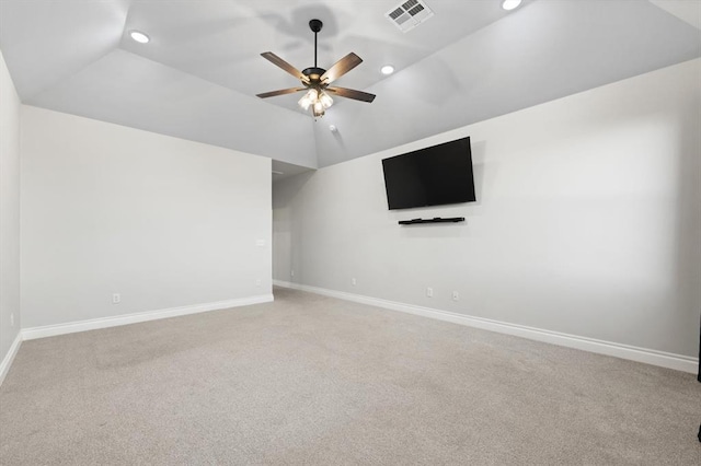 unfurnished room featuring visible vents, baseboards, and vaulted ceiling