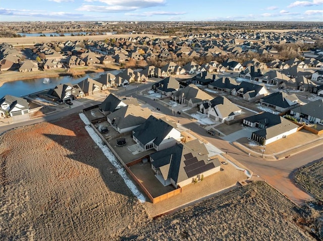 aerial view with a residential view and a water view