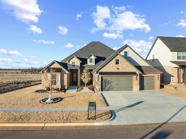 view of front facade featuring concrete driveway, a garage, brick siding, and roof with shingles