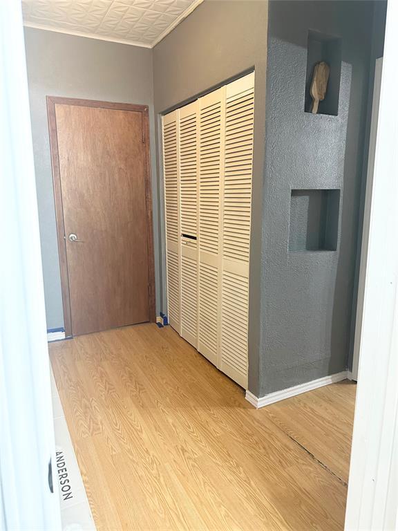 hallway with light wood-type flooring