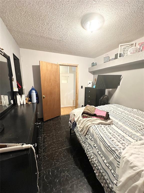 bedroom with a textured ceiling