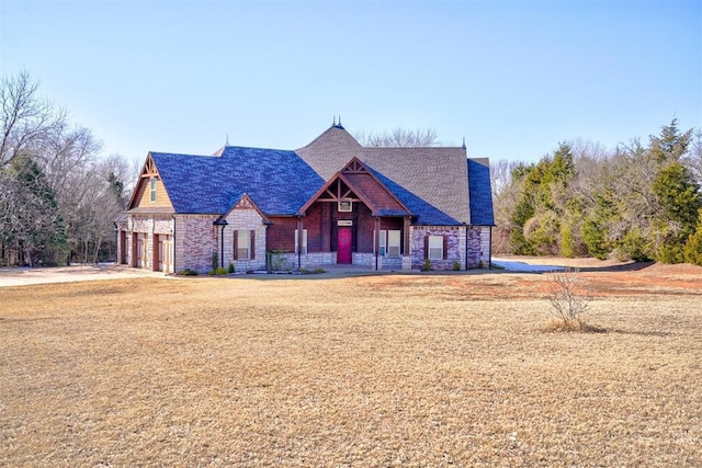 view of front of house with a front lawn and a garage