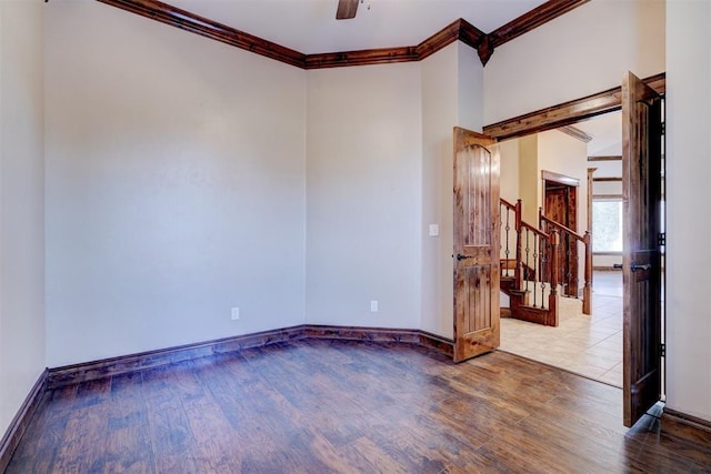 unfurnished room featuring ceiling fan, ornamental molding, and hardwood / wood-style floors