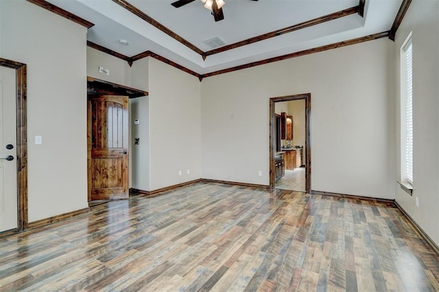 spare room featuring hardwood / wood-style floors and plenty of natural light