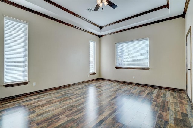 spare room with ceiling fan, crown molding, and dark hardwood / wood-style floors