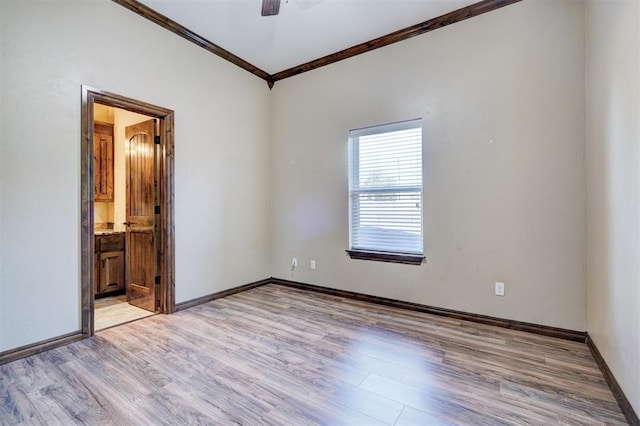 spare room with ceiling fan, crown molding, and light hardwood / wood-style flooring