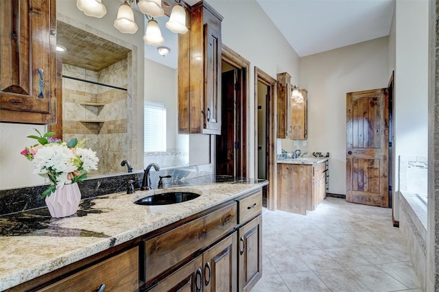 bathroom featuring tile patterned flooring, plus walk in shower, and vanity