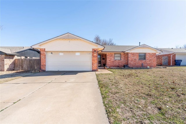 ranch-style home with a garage and a front lawn