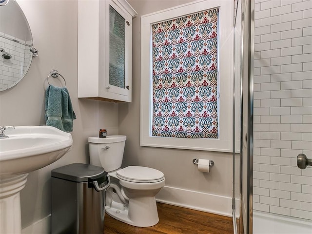 bathroom with toilet and tiled shower