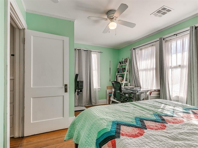 bedroom featuring ceiling fan and light hardwood / wood-style floors