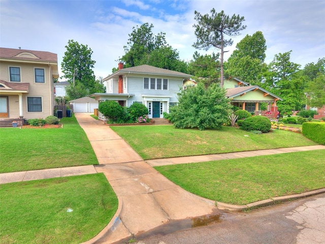 1322 NW 21st St, Oklahoma City, OK 73106 - view of front facade featuring an outbuilding, a front lawn, a chimney, and a garage