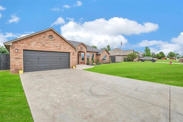 view of front facade with a garage and a front yard