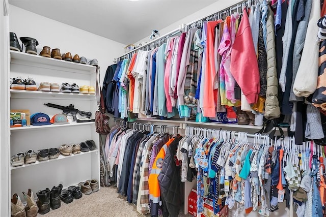 spacious closet with carpet floors