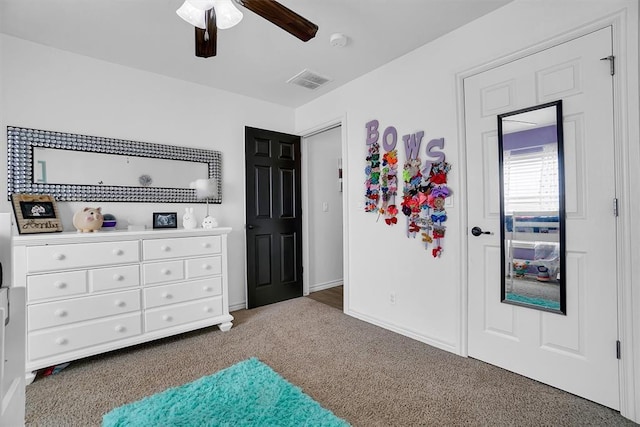 carpeted bedroom featuring ceiling fan