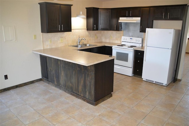 kitchen featuring sink, tasteful backsplash, hanging light fixtures, kitchen peninsula, and white appliances