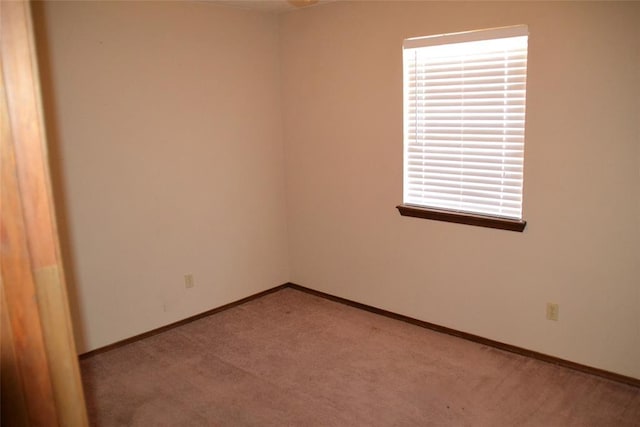 empty room featuring light colored carpet