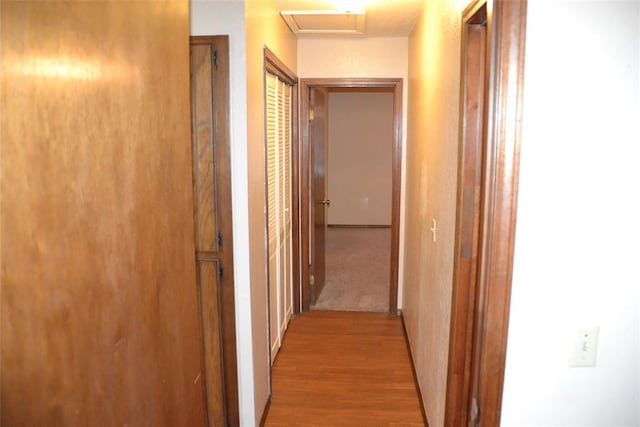 corridor with light hardwood / wood-style flooring