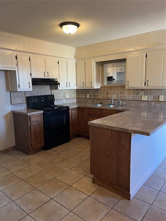 kitchen with sink, kitchen peninsula, black electric range, and light tile patterned floors