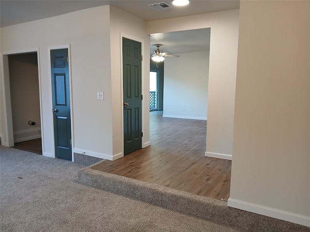 spare room featuring carpet flooring and ceiling fan