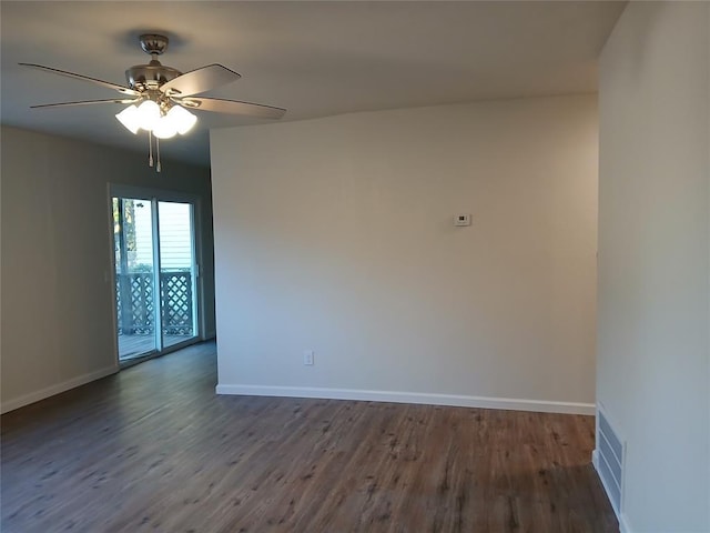 unfurnished room featuring ceiling fan and dark hardwood / wood-style floors