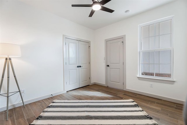 unfurnished bedroom with wood-type flooring and ceiling fan