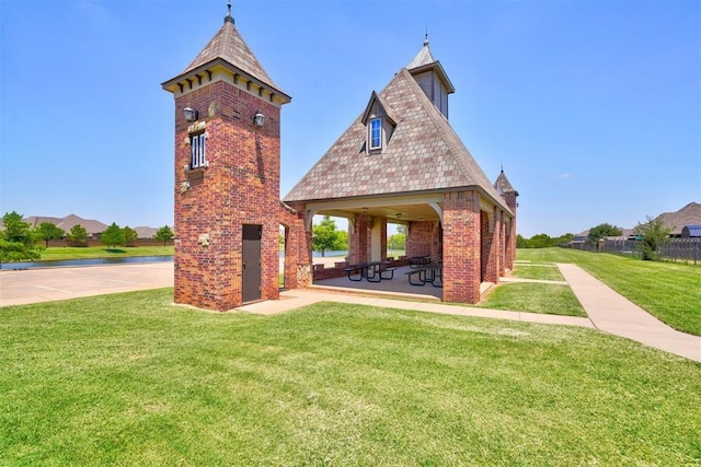 view of home's community with a gazebo and a lawn